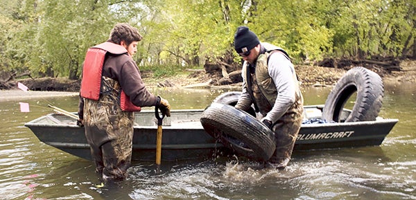 The Conservation Corps of Minnesota and Iowa recently pulled about 220 tires from a stretch along the Cedar River south of Austin. Since 2011, volunteers and workers have pulled nearly 700 tires from the river in the area. Photo provided by Nate Howard