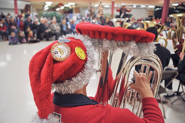 Valerie Pitzen was decked out for the holidays while participating in TubaChristmas in 2011 at the Oak Park Mall. Herald file photo