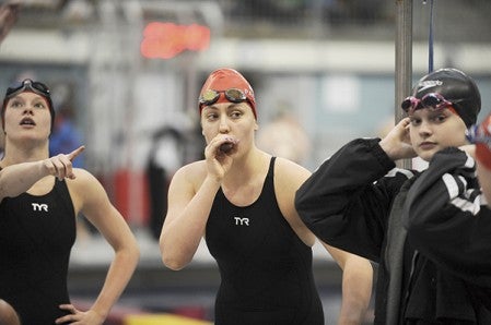 Austin's 200-yard freestyle relay team gets ready to compete Tuesday at the girls' Class A state swimming preliminaries at the University of Minnesota Aquatic Center in Minneapolis. The Packers took 17th place in 1:42.37. -- Micah Bader/Albert Lea Tribune  