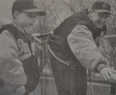 Steve Serratore, left, works on a tee with his dad Joe Serratore when Steve was 7-years old. Herald -- Herald File Photo