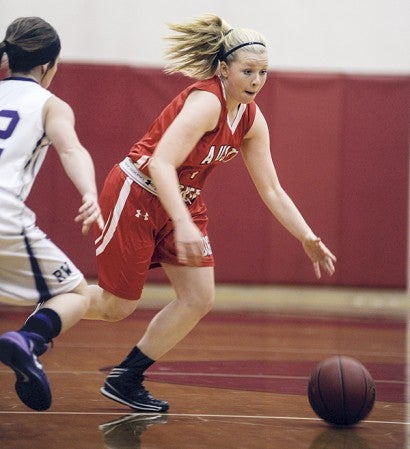 Austin's Sydney Murphy drives during the first half Tuesday night against Red Wing at Ove Berven Gym. Eric Johnson/photodesk@austindailyherald.com