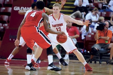 Davidson Wildcat Joe Aase (13) defends against the Bulldogs in first-half action in November. Aase is in his first year in Davidson after a standout varsity stint with the Austin Packers. Tim Cowie/Davidson University