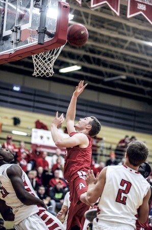Austn's Zach Wessels puts a shot up in the first half against Mankato West Thursday night in Packer Gym. Eric Johnson/photodesk@austindailyherald.com
