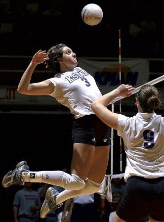 Austin resident Lauren Cost goes up for a hit during her volleyball career at Kansas State University. -- Photo Provided