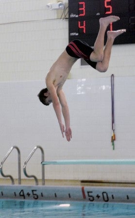 Austin's Jacob Browning dives at Bud Higgins pool in Ellis Middle School Thursday. -- Rocky Hulne/sports@austindailyherald.com