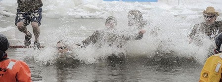 Members of Team Akkerman make a splash during their plunge.