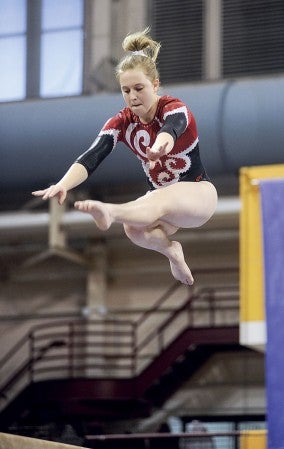 Austin's Sela Fadness performs on the balance beam during the Minnesota State Class A Individual Meet Saturday at the University of Minnesota Sports Pavilion in Minneapolis. Eric Johnson/photodesk@austindailyherald.com
