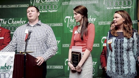 Reed Kuper, his wife, Ashley, and Daneka Thomas of Sassy Strawberry accept the award for New Business of the Year.