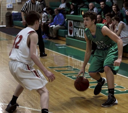 Jordan Cotter handles the ball for Lyle-Pacelli in Pacelli Gym Thursday. -- Rocky Hulne/sports@austindailyherald.com