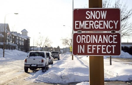 Snow emergency signs remained out Wednesday following another storm that dumped 10 inches on the area Tuesday night. 