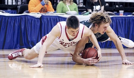 Austin's Jacob Kempen contends for the loose ball with Holy Family's Colton Stenerson during the first half of their Class AAA semifinal matchup of the Minnesota State Boys Basketball Tournament at Target Center. Eric Johnson/photodesk@austindailyherald.com