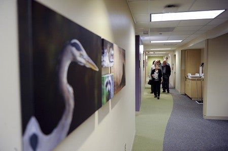 People walk down the halls of the Karl R. Potach Pediatric Clinic Wednesday night.