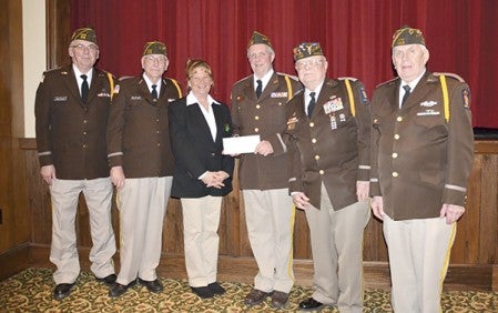 Austin VFW post No. 1216 received $8,253 to buy new uniforms recently. Pictured, in no particular order, is Clayton Oehler, Russell Ashley, Debbie Hanson, Scott Wiechmann, Norman Hecimovich, Mel Flicek and Norman E. Hecimovich. Photo provided