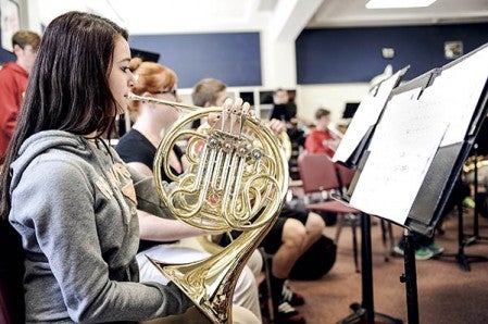 French horn player Kelsey Ross, sophomore, rehearses with the wind ensemble in preparation for the upcoming Big Band Blast. Eric Johnson/photodesk@austindailyherald.com