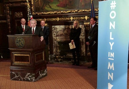 Joined by business representatives and DNR Commissioner Tom Landwehr, Governor Mark Dayton and Explore Minnesota Tourism Director John Edman introduce the state’s largest-ever marketing campaign to boost tourism in Minnesota.  Photo provided