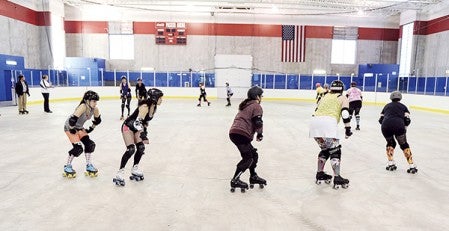Members of the Minnesota Southbound Rollers practice in Packer Arena Monday evening, their first practice of the year. Eric Johnson/photodesk@austindailyherald.com