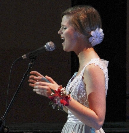 Molly Kate Kestner sings "Young and Beautiful" from the soundtrack to the 2013 film version of "The Great Gatsby," which was the theme for Austin High School's prom Saturday. Kestener was set to sing to kick off the Grand March in Knowlton Auditorium before she found online fame last week when her song "His Daughter" has been viewed more than 4.2 million times. Jason Schoonover/jason.schoonover@austindailyherald.com