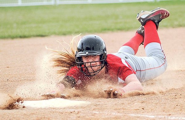 Austin's Shayley Vessel slides into third during the first inning against Mankato West at Todd Park Tuesday night. Eric Johnson/photodesk@austindailyherald.com