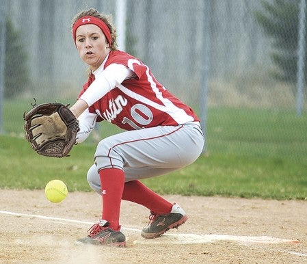 Austin's McKenna Gleisner eyes a one-hopper into her glove during the Packers' game against Mankato West Tuesday night at Todd Park. Eric Johnson/photodesk@austindailyherald.com