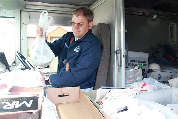 Postal carriers will once again be collecting food Saturday during their annual competition with Albert Lea. -- Herald file photo.