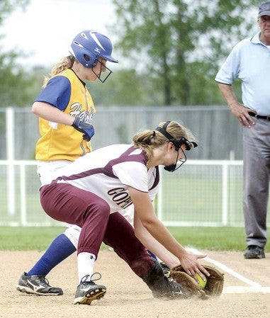 Hayfield's Kyal Heydt sneaks back to first before Chatfield's Brook Irish can get the tag on her on a pick-off attempt in the Section 1A elimination game Tuesday at Todd Park. Eric Johnson/photodesk@austindailyherald.com