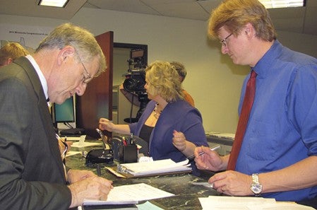 Dennis Schminke fills out paperwork to run for his run at the District 27B seat. -- Photo provided.