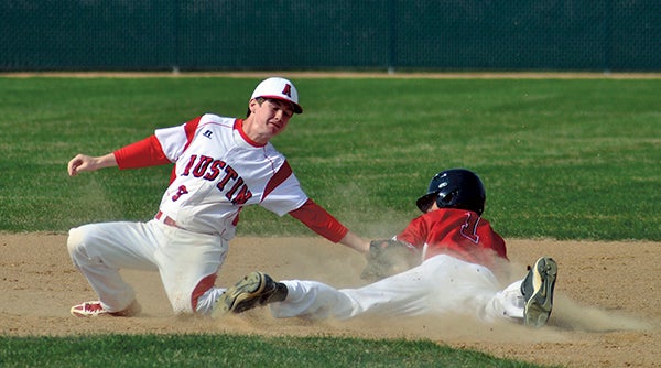 Austin's Hunter Lewis places the tag on Mankato West's Tyler Stoffel at second base in Dick Seltz Field Wednesday. -- Rocky Hulne/sports@austindailyherald.com