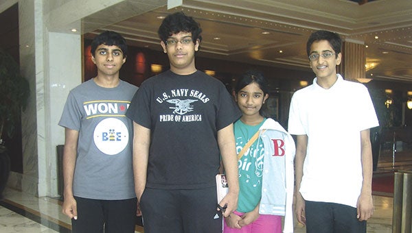 Shane DeSilva and his sister, Shenali, center, pose with 2014 Scripps National Spelling Bee co-champions Ansun Sujoe, left and Sriram Hathwar, right. It was the first tie since 1962. Photos provided by Sam DeSilva