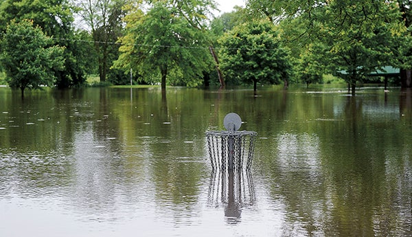 The disc golf course at Driesner Park will be out of commission for quite some time as waters from the Cedar River rose in the night after another round of showers blanketed the area. -- Eric Johnson/photodesk@austindailyherald.com