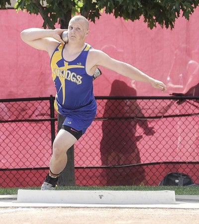 Hayfield's Cody Carpentier spins on his first throw during the Class A Minnesota State Track and Field Meet Friday at Hamline University in St. Paul. Eric Johnson/photodesk@austindailyherald.com