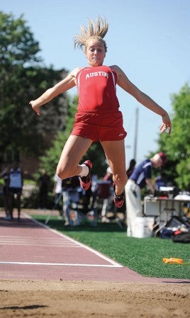 Austin's Carolyn Hackel makes her second jump in the long jump during the Minnesota State Track and Field Meet at Hamline Universisty in St. Paul Friday. Eric Johnson/photodesk@austindailyherald.com