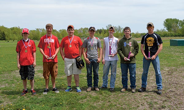 The Austin clay shooting team recently held a home meet. From left to right, the first place squad from Austin of Jackson Hollund, Jacob Browning, Alex Fieblekorn, Logan Kittridge, and John Ferris. Ferris also took first place in Individual Scoring with a 49 out of 50. Luther Langrude of Alden Conger, 6th from left, took second place in Individual and Kyle Bartz, far right, took third place in Individual. -- Photo Provided