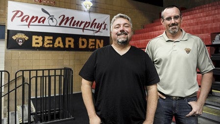 Austin Bruins owner Craig Patrick stands with Papa Murphy’s owner Mike Cooper, who was named minority owner of the team in July. Herald file photo