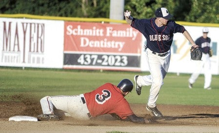 Austin Blue Sox shortstop Jamie Adams looks to relay after getting the force out on the Greyhounds' Nels Nelson Wednesday night at Marcusen Park. Eric Johnson/photodesk@austindailyherald.com