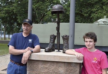 Sam Hagan stands with artist Neil Brodin who created the Fallen Soldier Memorial statue similar to the one Hagan will include in his memorial behind the VFW. Photo providedJenae Peterson/jenae.peterson@austindailyherald.com