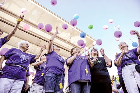 Survivors release their balloons following the Survivors Walk Saturday night during the annual Mower County Relay for Life. 