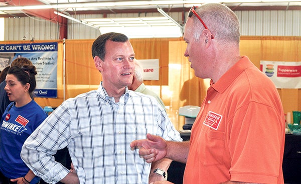 Republican governor candidate Jeff Johnson talks to a supporter Saturday afternoon at the Mower County Fair. -- Trey Mewes/trey.mewes@austindailyherald.com