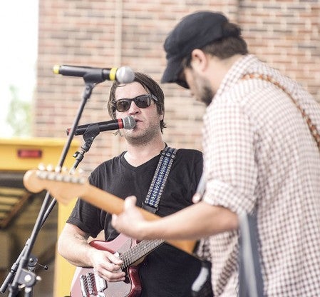  Jim Waller, left, and Jeremy Jewell of Weathered Ivan perform on the outdoor stage