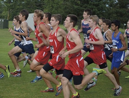 A group of Austin runners run together at the Austin cross country invite in Meadow Greens Golf Course Tuesday. -- Rocky Hulne/sports@austindailyherald.com