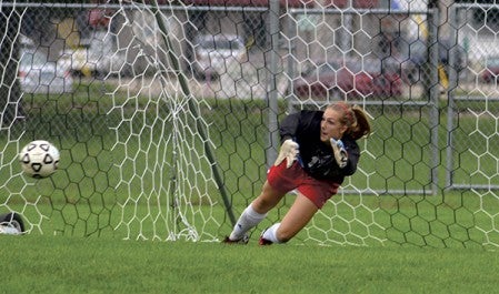 Austin's Chloe Summerfield dives to make a save against Loyola. Herald File Photo