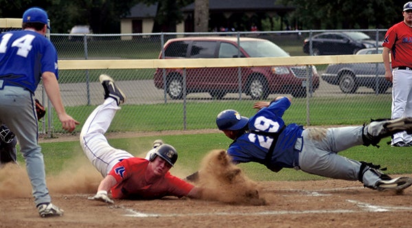 Brian Voigt of the Austin Blue Sox slides home to score a run in the first inning in Marcusen Park Wednesday. -- Rocky Hulne/sports@austindailyherald.com