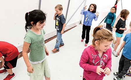 Students from the Blue Ducklings check out the new greenhouse at Woodson Kindergarten Center Tuesday afternoon. 