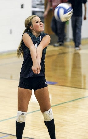 Lyle-Pacelli's Brooke Walter receives a serve during game one of a match against Schaeffer academy Tuesday night in Lyle. Eric Johnson/photodesk@austindailyherald.com