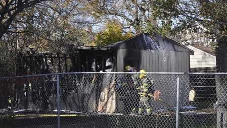 The Austin Fire Department responds to a garage fire on the 400 block of Fifth St. NW Monday afternoon.