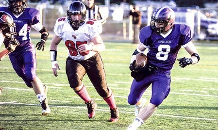 Grand Meadow quarterback Michael Stejskal carries on a first-quarter run against Spring Grove in the Section 1 Nine-Man Championship Friday night in Rochester. Eric Johnson/photodesk@austindailyherald.com