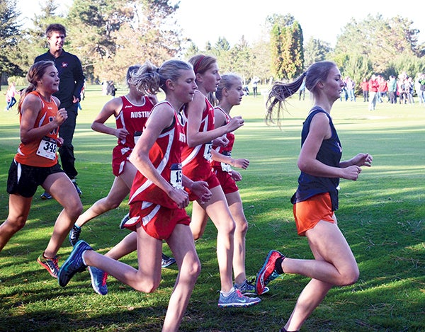 Austin's Abby Lewis, Paiton Schwab, Morgan Hose and Tasia Martinson run together as a pack at the Austin Invite Tuesday. -- Rocky Hulne/sports@austindailyherald.com