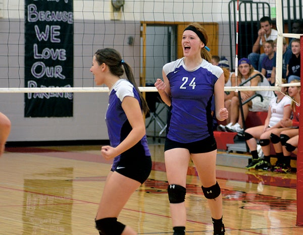 Rio Landers celebrates a point for Grand Meadow as the Superlarks beat the Cardinals in four games in LeRoy Monday. -- Rocky Hulne/sports@austindailyherald.com