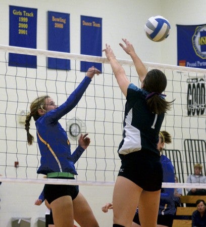 Hayfield's Madison Heydt goes up for a hit against Fillmore Central Monday. -- Rocky Hulne/sports@austindailyherald.com
