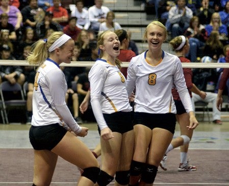 Hayfield's Jo Bungum, Carrie Rutledge and Katelyn Bjornson celebrate a point in game one against FBA. -- Rocky Hulne/sports@austindailyherald.com