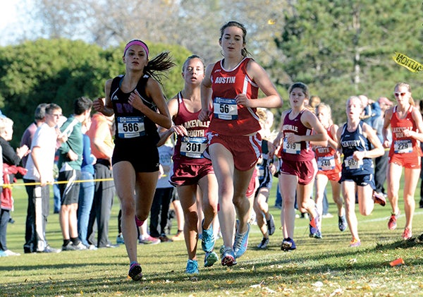 Austin's Madison Overby leads a pack of runners at the Sectiono 1AA championships in Owatonna Thursday. The Packers took second in the meet to advance for the first time in school history. -- Rocky Hulne/sports@austindailyherald.com